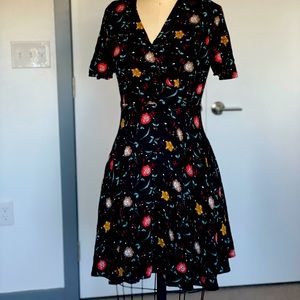 Floral, side zipper and front snap buttons.